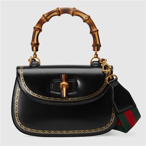 gucci handbag with bamboo handle.